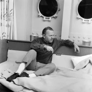 Film and TV star Mickey Rooney in his cabin of the U. S.s United States at Le Havre