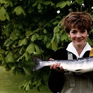 Fiona Armstrong ITN TV Presenter and News reader holding a fish May 1991