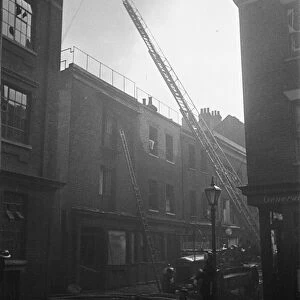 Fire fighters and emergency workers fight a fire at Brown Brothers, Great Eastern Street
