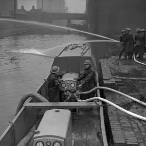 Fire Float Practice. Members of the Birmingham Auxiliary Fire Service Naval Detachment Fire Float Practice. Members of the Birmingham Auxiliary Fire Service Naval Detachment