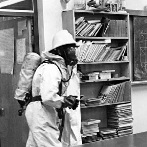 A firefighter checks the classroom is safe