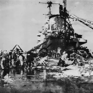 Firefighters on board HMS Formidable inspect the wreckage Firefighters on board HMS Formidable inspect the wreckage