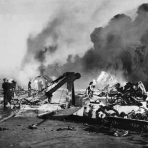 Firefighters busy on board HMS Formidable after a Japanese suicide plane had crashed Firefighters busy on board HMS Formidable after a Japanese suicide plane had crashed