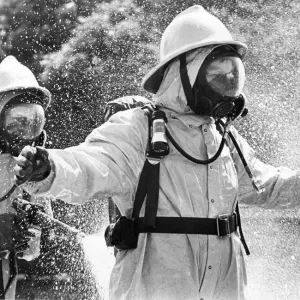 Firefighters wearing protective suits fought a blaze in an asbestos unit at Poter Limited Firefighters wearing protective suits fought a blaze in an asbestos unit at Poter Limited
