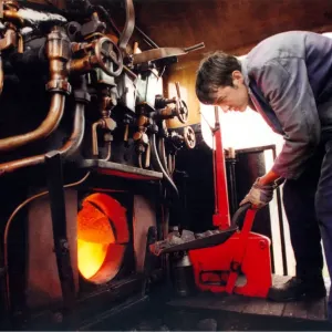 Fireman Andrew Arnold, stokes up the Tanfield Rambler on 28th August 1997 Fireman Andrew Arnold, stokes up the Tanfield Rambler on 28th August 1997