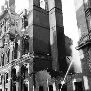 A fireman hoses down smoking remains of a building in Southwark London after an air raid A fireman hoses down smoking remains of a building in Southwark London after an air raid