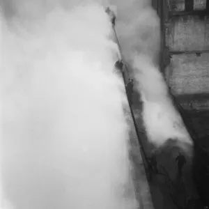 Firemen tackling a fire at Taylors Great Central Depository in St Georges Road