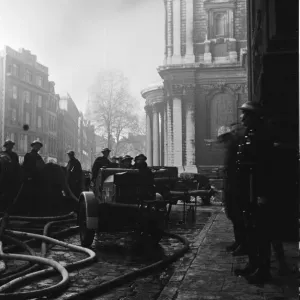 Firemen tackling fires in St Pauls Churchyard to stop the blaze reaching Firemen tackling fires in St Pauls Churchyard to stop the blaze reaching