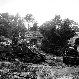 The first British regiment into Germany. Honey Reece tanks arriving with burnt out