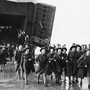 The first party of ATS attached to the 21st Army Group seen here coming ashore from a