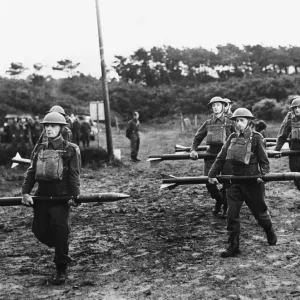 First pictures of the Home Guard A. A in action Carrying the rockets to the projectors