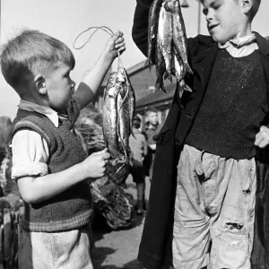 Two of the Fish Wharf Gang with the days takings at Great Yarmouth