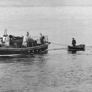 A fisherman is towed to safety by the Tynemouth lifeboat A fisherman is towed to safety by the Tynemouth lifeboat