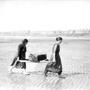 Fisherwomen of New Biggin England carrying their catch Women fulfilling Mens work Fisherwomen of New Biggin England carrying their catch Women fulfilling Mens work