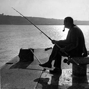 Fishing - Major R. E. Vargas of Pontypridd sits at the entrance to Cardiff Docks for a