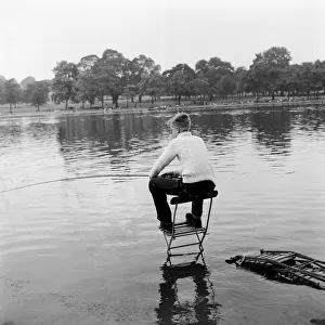 Fishing on the Serpentine in Londons Hyde Park. 8th August 1957