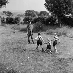 Fitzroy Maclean playing with his children, Jeremy, Susan Fitzroy Maclean playing with his children, Jeremy, Susan