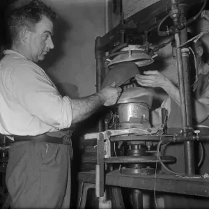 Flat cap being pressed on to a mould at the Denham and Hargreaves factory, Atherstone Flat cap being pressed on to a mould at the Denham and Hargreaves factory, Atherstone