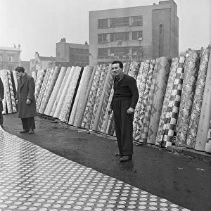 The flea market at Club Row, Bethnal Green, E2 London 1st March 1955 Linoleum salesmen