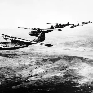 A flight of Consolidated Catalina flying boats of the US Navy flying in formation as used A flight of Consolidated Catalina flying boats of the US Navy flying in formation as used