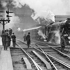 The Flying Scotsman steam train leaving Kings Cross station in London on its initial non
