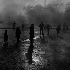 Print of boys sliding on ice in Hampstead Heath fog Print of boys sliding on ice in Hampstead Heath fog
