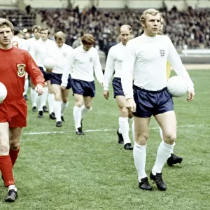 Football England v Wales 1969 Alan Durban and Bobby Moore lead out their teams