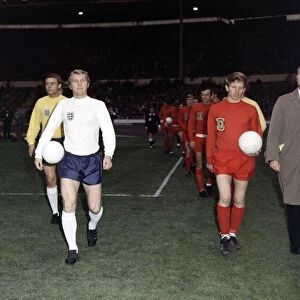 Football England v Wales 1969 Bobby Moore walks on to the pitch with ball under