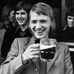 Football fan Paul Morgan enjoys a pint of beer before going to watch his team