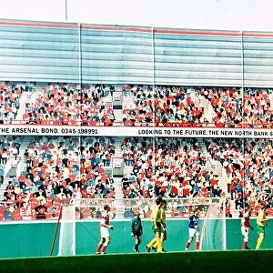 Football fans painted on the North Bank development at Arsenal