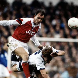 Football player Steve Bould for Arsenal against tackles Teddy Sheringham Football player Steve Bould for Arsenal against tackles Teddy Sheringham