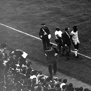 Football - World Cup 1966 Portugal v Brazil Pele is led off the pitch injured