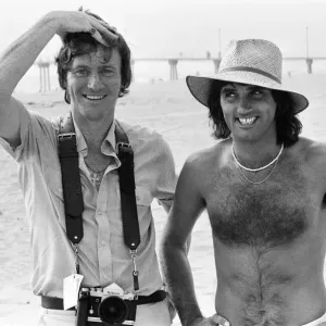 Footballer George Best poses on the beach withDaily Mirror Staff Photographer Kent Gavin Footballer George Best poses on the beach withDaily Mirror Staff Photographer Kent Gavin