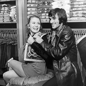 Footballer George Best seen here with Juliet Mills at his boutique in Manchester