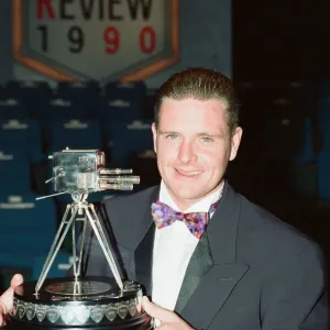 Footballer Paul Gascoigne smiles as he holds the Sports Personality of The Year award Footballer Paul Gascoigne smiles as he holds the Sports Personality of The Year award