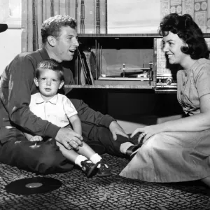 Print of Colin Grainger and family listening to his new record, January 1960