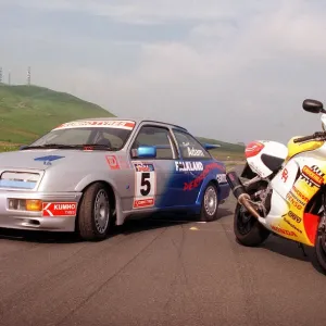 Ford Sierra Cosworth in racing trim with a Honda motorbike. July 1999