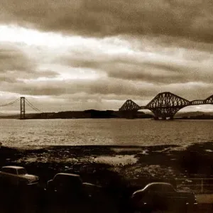 Forth Railway Bridge in Scotland - October 1964 Forth Road Bridge in the distance
