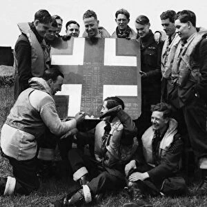 A fragment cut from an enemy aircraft which the RAF squadron shot down is used for
