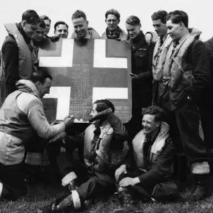 A fragment cut from an enemy aircraft which the RAF squadron shot down is used for A fragment cut from an enemy aircraft which the RAF squadron shot down is used for