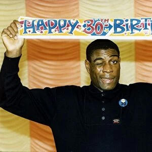 Frank Bruno boxer holding happy birthday poster above head