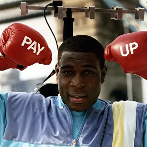 Frank Bruno Boxing Standing under tv aerial wearing boxing gloves