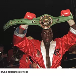 Frank Bruno celebrates after defeating Oliver McCall for the heavyweight title