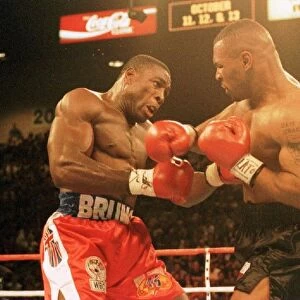 Frank Bruno and Mike Tyson battle it out during the WBC world title fight in Las Vegas