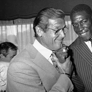 Frank Bruno and Roger Moore at Variety Club Awards party - 27 / 06 / 1989