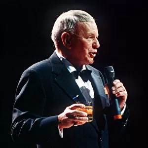Frank Sinatra sings in concert with drink in hand circa 1990
