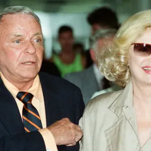 Frank Sinatra and wife Barbara Marx seen here arriving at Heathrow Airport 28th June 1990