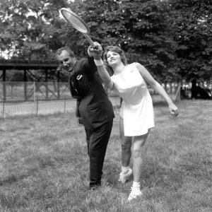 Fred Perry with actress Yvonne Buckingham, during a coaching session Fred Perry with actress Yvonne Buckingham, during a coaching session