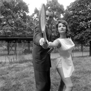Fred Perry with actress Yvonne Buckingham, during a coaching session Fred Perry with actress Yvonne Buckingham, during a coaching session