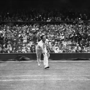 Fred Perry competing at The Mens singles Wimbledon Championships in 1934 on the centre Fred Perry competing at The Mens singles Wimbledon Championships in 1934 on the centre